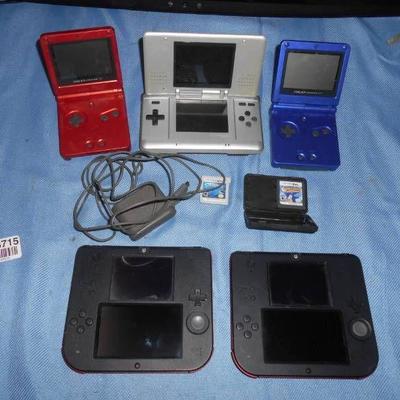Lot of Hand Held Nintendo Players Cords and Games