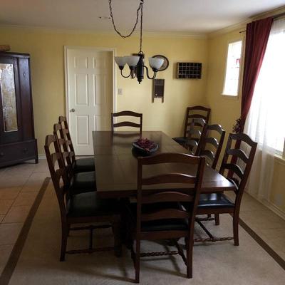 Excellent quality large dining table, there are 10 chairs