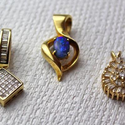 fine jewelry necklace pendants - in center, Lightning Ridge (Australia) black opal set in 18K yellow gold