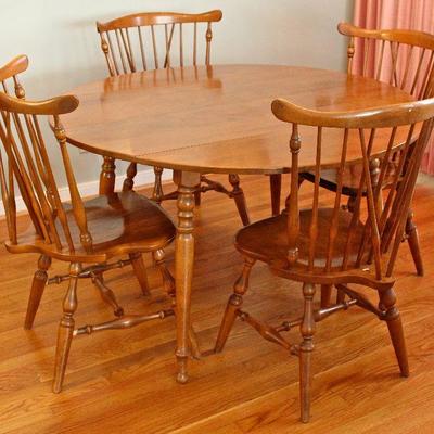 Ethan Allen dining table with (2) leaves & pads - makes an oval to seat 6-8, set of (4) braced back wood chairs