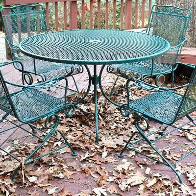 heavy duty patio table, 4 spring chairs, and umbrella