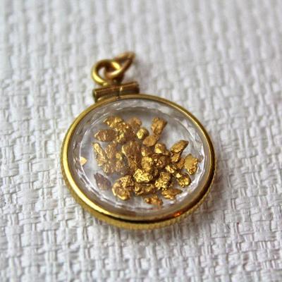 gold flakes in necklace pendant