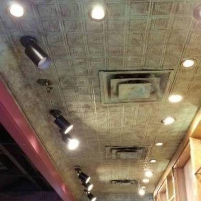 Aged Turquoise Decorative Ceiling Behind Bar