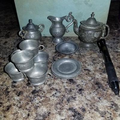 16 piece Antique pewter miniature tea set! 1 tea pot w/ lid, sugar bowl w/ lid, water carafe, bowl, 4 plates, 6 tea cups