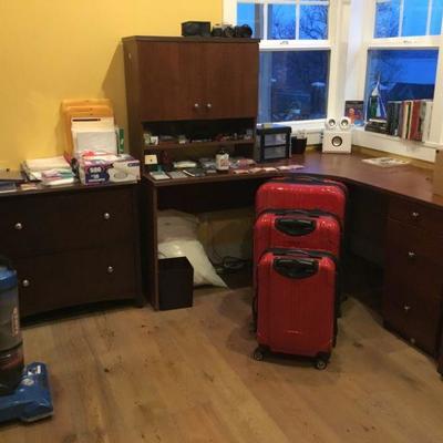 Office Furniture, File Cabinet, L-Shaped Desk with Top Hutch, Office Supplies, Books, Cameras, Luggage, Vacuum Cleaner.