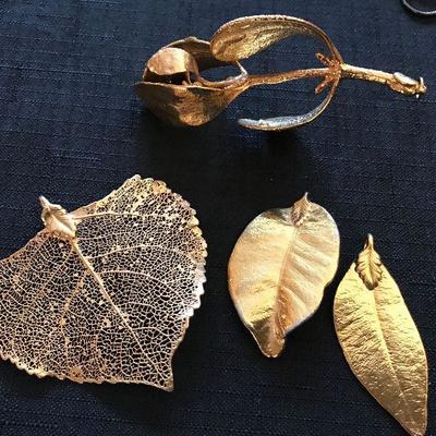 Leaves and a mistletoe dipped in 24K gold. Converted to pendants