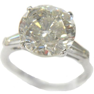 Ring with 7 Carat Round Solitaire Diamond.