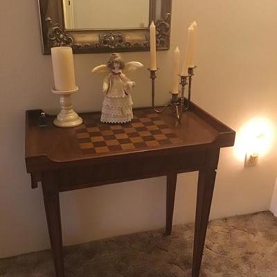 Small table with checker board on top 