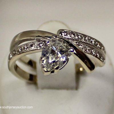 14 Karat White Gold 1.01 Center Pear Diamond H/SI and Â¼ Diamond CTW Ring â€“ auction estimate $1500-$2500 