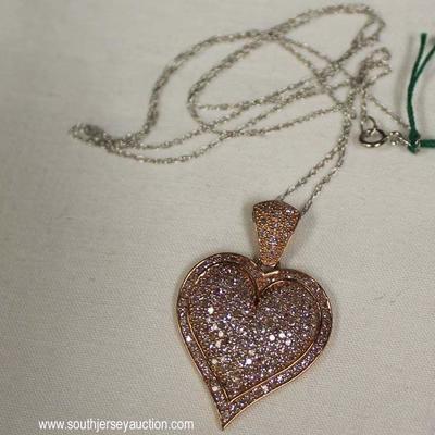 10 Karat Rosewood Gold 1 CTW Diamond Heart Pendant and Chain â€“ auction estimate $300-$600 