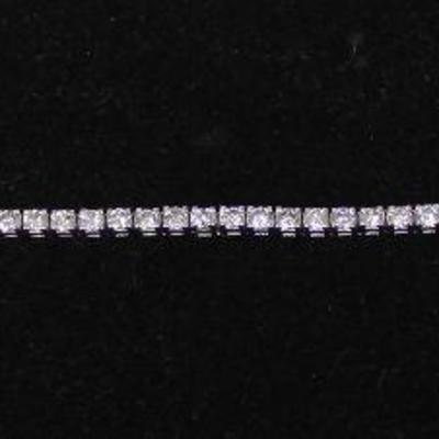 14 Karat White Gold 4 CTW Diamond Tennis Bracelet â€“ auction estimate $1500-$2500 