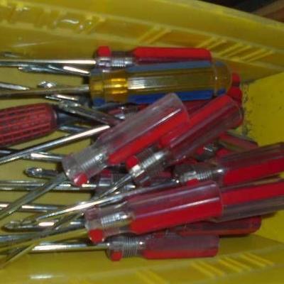 Plastic Tote With Screw Drivers.