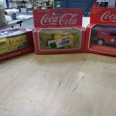 Three Coca Cola Matchbox cars (listed in descripti ...