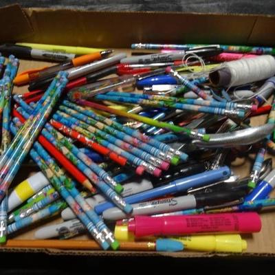 Lot of pencils, pens, markers, and hole punchers