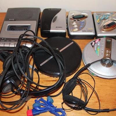 #212  Lot- Vintage Cassette player/recorder, walkman, cd players, cords, headphones
PRICE:  $8