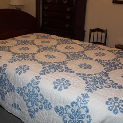 #118  Full size vintage cross stitched quilt blue and white - stained
PRICE:  $8