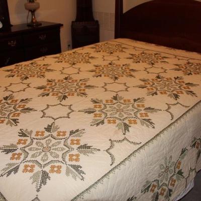 #117  Full size vintage cross stitched quilt greenish gray and gold - stained
PRICE:  $8