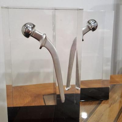 PROBABLY ONE OF A KIND - Acrylic bookends with titanium shoulder replacement prosthesis.  (pair)