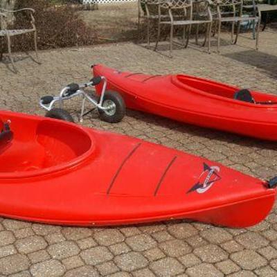 Pair of kayaks with paddles