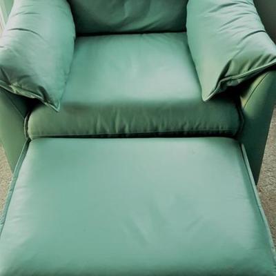 Comfortable turquoise leather chair and ottoman