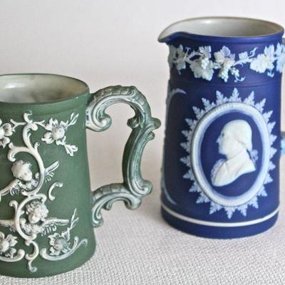 collection of ceramic/porcelain pitchers, including Wedgwood