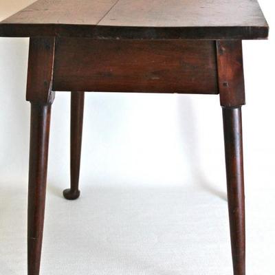 small, antique table with pad feet