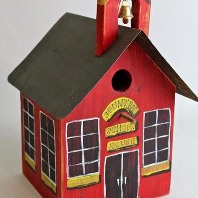 collection of bird houses, both decorative and functional