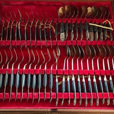 1950's Thai brass and rosewood flatware set  $650
