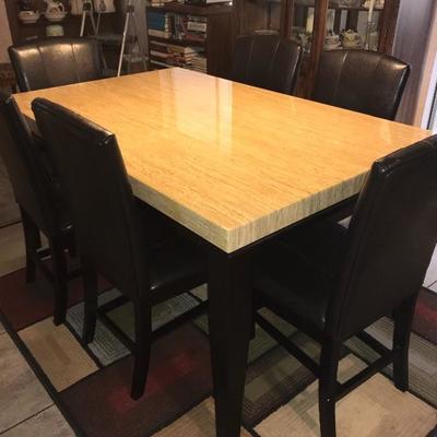Beautiful Granite Table With Six Leather Chairs 