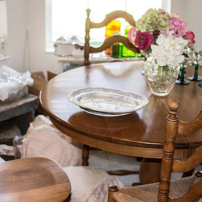 Maple finish kitchen set with four chairs and extra leaf for the table.