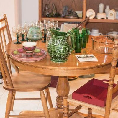 Maple finish kitchen set with four chairs and extra leaf for the table.