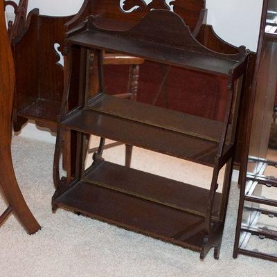 Antique curio and wood shelves.