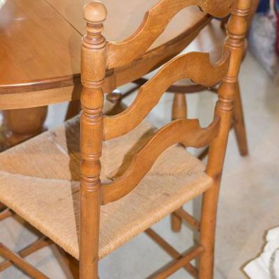 Maple finish kitchen set with four chairs and extra leaf for the table.