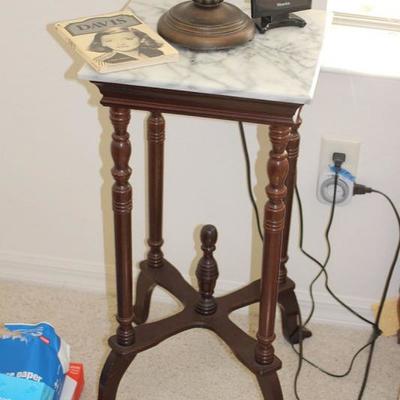 One of a pair of antique marble top tables