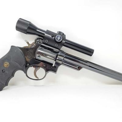#148: Smith & Wesson Model 53 .22 Mag Revolver with Scope and Original Box
Serial Number: K445937 Barrel Length: 8.375