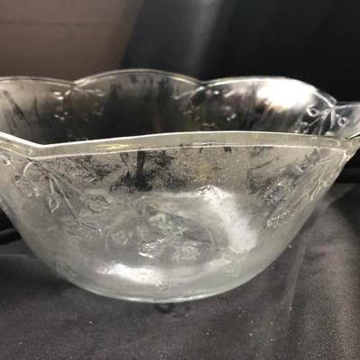 Glass punch bowl embossed with flowers and other items