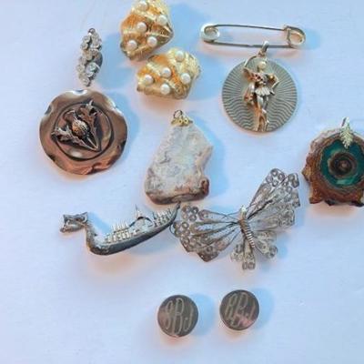 A collection of pins and pendants