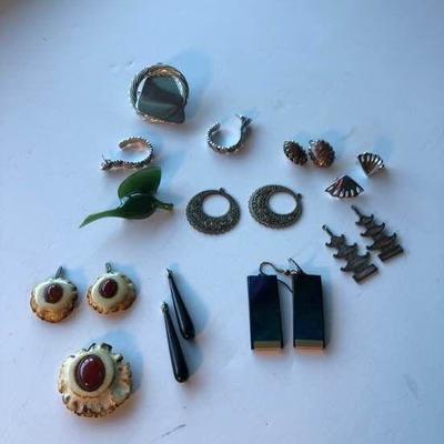 A collection of earrings and two more