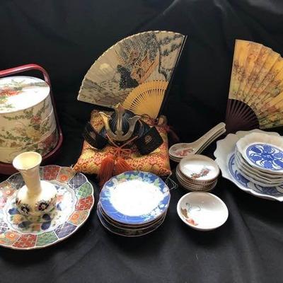Collection of Asian China including a ceramic lunchbox and a couple of fans