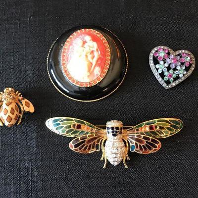 Joan Collins brooches.