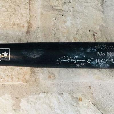 Ivan 'Pudge" Rodriguez (HOF) game day black bat with his signature in silver sharpie. Estate sale price: $465