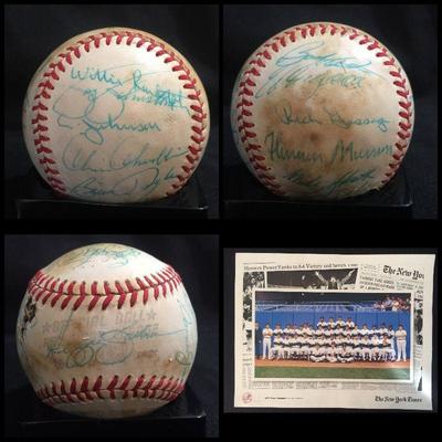 Signed Baseball by the 1977 World Champion New York Yankees including Billy Martin signature in one of the sweet spots and team picture....