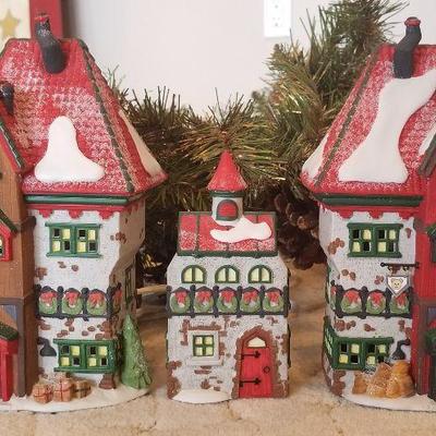 Deptartment 56. Dept 56. Comes with original box.
North Pole  Dolls and Santa's Bear Works $20