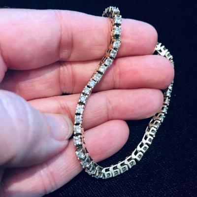 All jewelry reviewed and detailed by Jewelry Appraiser: 14K GOLD WITH 4.0 CT DIAMONDS (TOTAL 50 DIAMONDS). Includes certificate. $4,000