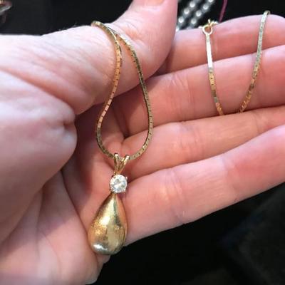All jewelry reviewed and detailed by Jewelry Appraiser: 14K GOLD WITH 0.40 CT DIAMOND. 24-INCH 14K GOLD CHAIN. $2,200