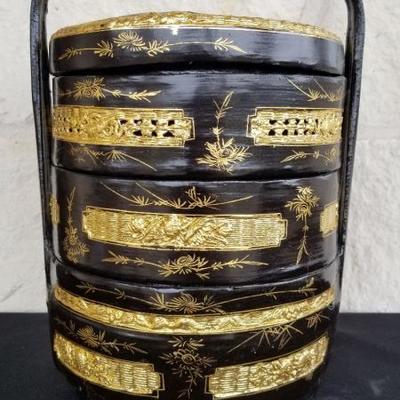 Also known as the 'bakul siah', this 3tiered basket is an important item in the proceedings of a traditional 12-day Peranakan...