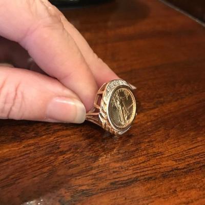 All jewelry reviewed and detailed by Jewelry Appraiser: GOLD LIBERTY DOLLAR. 0.10 CT DIAMOND. 14 K GOLD RING. $1,250