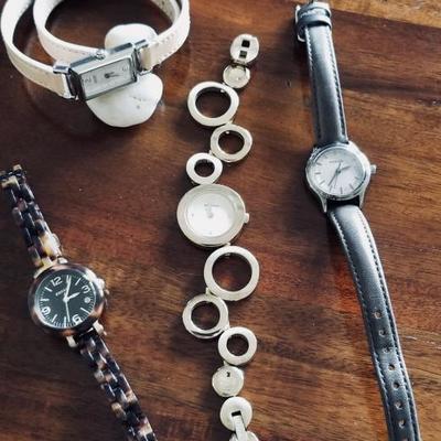 Coach watch (upper left hand) $75. Fossil watch (left bottom) $40. Fossil watch (middle bottom) $50. Fossil watch (right bottom) $45.