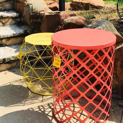 The yellow one on the left is an Adeco Home Garden accents wire round iron metal stool end table. 