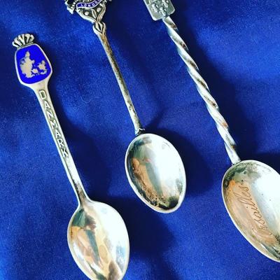 Over 25 sterling silver souvenir spoons from Europe, Canada and U.S.